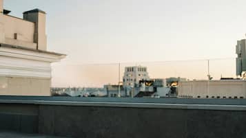 A rooftop pool with a clear view of surrounding buildings.