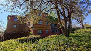 A multi-story building with a brick facade and multiple windows. - London, Heathrow & Twickenham Stadium Stay (Isleworth)