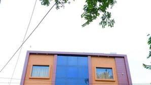 A building with the sign "Ananda Castle" at the entrance. - Ananda Castle (Vrindavan)