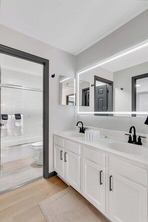 Shower, towels, soap, toilet paper