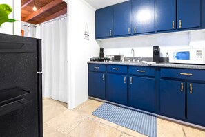 Fridge, microwave, stovetop, coffee/tea maker
