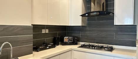 Fridge, microwave, cookware/dishes/utensils