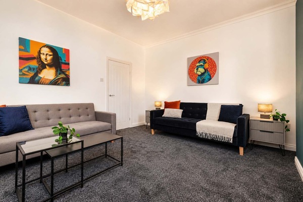 Unwind in a bright, airy living room with comfortable seating, elegant décor and lighting. The spacious layout and contemporary furnishings create a calm, inviting setting to relax, recharge and enjoy quiet moments together throughout your stay here!