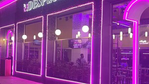 A building with the sign 'DESPECHO' illuminated in neon lights. -  Phenomenal ocean view  2bed, 2 bath Apartment. (Cancún)