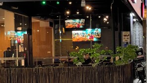 A sushi restaurant with a black awning and the name 'sushitto' in red and white letters. -  Phenomenal ocean view  2bed, 2 bath Apartment. (Cancún)