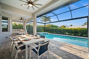 Outdoor dining - Modern Luxury Home • 5 Minutes to Beach • Heated Pool & Spa (Marco Island)