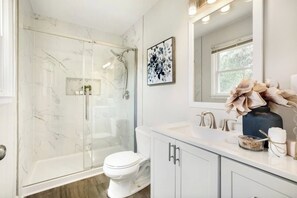 Shower, towels, soap, toilet paper