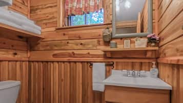 Shower, hair dryer, towels, toilet paper