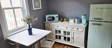 Fridge, microwave, coffee/tea maker, cookware/dishes/utensils