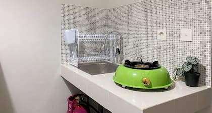 Minimalist And Cozy 1BR at Royal Heights Apartment