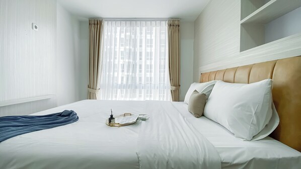 Bed sheets - Comfy and Homey 2BR at Tokyo Riverside PIK 2 Apartment (Teluknaga)
