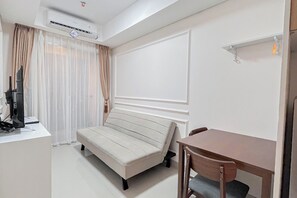 Living room - Comfy 1BR Apartment at Tamansari Skylounge Makassar (Makassar)