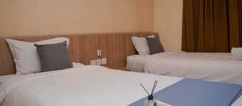 Warm and Minimalist Studio (No Kitchen) at Great Western Apartment