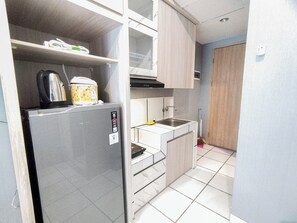 Private kitchen - Restful and Simply Studio at The City Square Apartment (Surabaya)