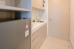 Standard Studio, 1 Bedroom (Apartment) | Private kitchen - Minimalist and Restful Studio Apartment at Tokyo Riverside PIK 2 (Teluknaga)