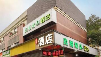A building with a sign for a hotel and a restaurant.