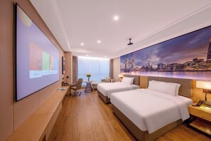 A hotel room with two beds, a desk, a chair, a TV screen, and a cityscape mural on the wall. - Hangzhou Yuecheng Audio & Video International Hotel (Boao Xinhan Road Subway Station) (Hangzhou)