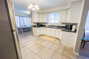 Fridge, microwave, stovetop, coffee/tea maker