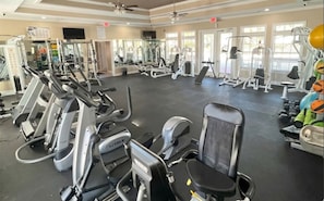 A gym with treadmills, ellipticals, and weight machines.