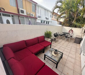 Outdoor dining - Rincon 2-bedrm apartment with Generator, AC, walk to beach, pool option & town. (Rincón)