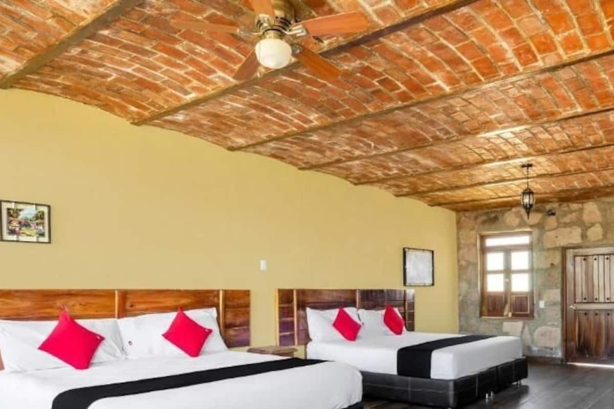 Deluxe Quadruple Room, Mountain View | In-room safe, laptop workspace, iron/ironing board, free WiFi