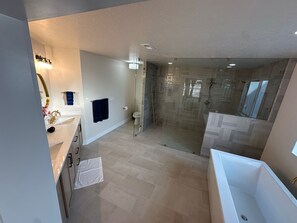 Shower, hair dryer, towels, toilet paper