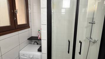 Shower, hair dryer, towels, toilet paper