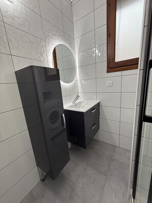 Shower, hair dryer, towels, toilet paper