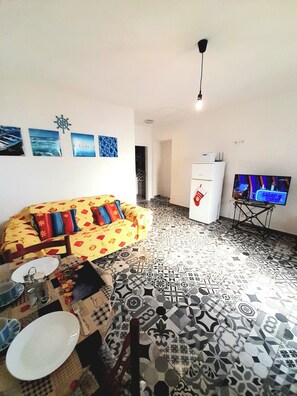 Deluxe-huoneisto, näköala puutarhaan | Oleskelualue