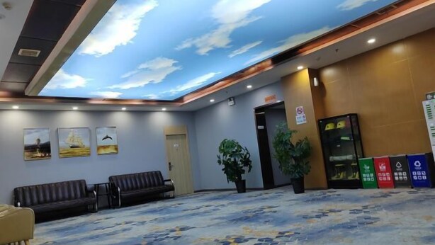 A hotel lobby with a ceiling mural, seating area, and recycling bins. - Yiju Hotel (Xi'an Bell and Drum Tower Ximen Children's Hospital Branch) (Xi'an)