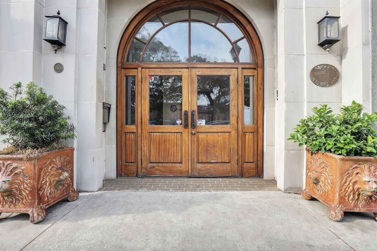 Step through charming arched doorways and wooden double doors that whisper, “Welcome to your Savannah storybook stay.”