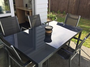 Relax on the patio with a candlelit table and comfortable seating.