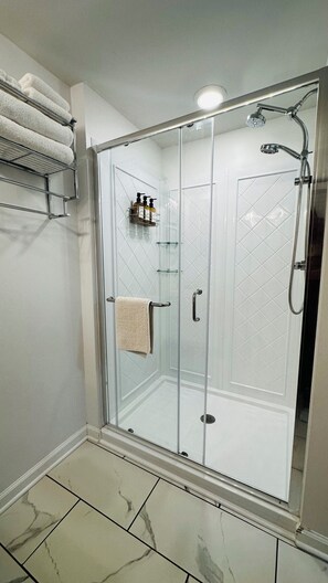 Shower, hair dryer, towels, soap