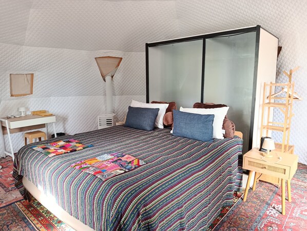 A bedroom with a bed, bedside table, lamp, and a wooden ladder. - Krabi Campsite Glamping & Camping (Krabi)