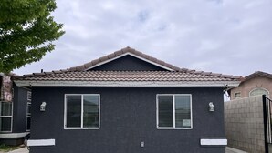 A two-story house with a dark facade and a tiled roof. - New ADU -  Charming 1-bedroom house with AC, WiFi in fabulous Bakersfield (Bakersfield)