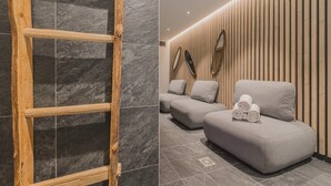 A spa area with a wooden ladder, grey cushioned seating, and a wall with vertical wooden slats and mirrors. - Apartment in Plan Peisey Near Vanoise Park (Peisey-Nancroix)