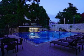 Seasonal outdoor pool, open 8:00 AM to 11:30 PM, pool umbrellas