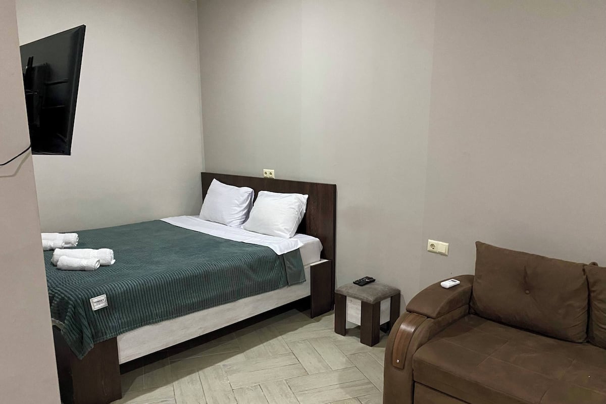 Deluxe Double Room, Mobility Accessible, Pool View | In-room safe, desk, iron/ironing board, rollaway beds