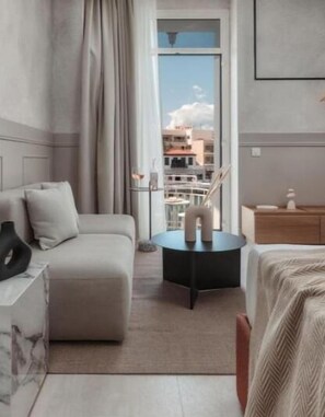 Enjoy a city view from the large window, relax on the sofa, and unwind in this peaceful retreat.