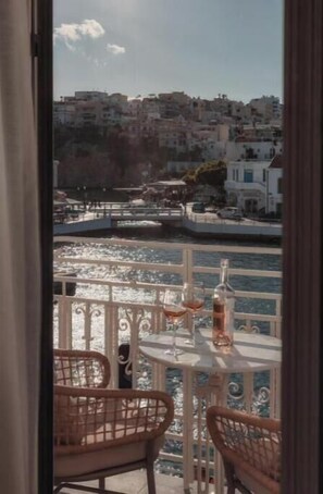 Enjoy a glass of wine on the balcony with a view of the coastal town.