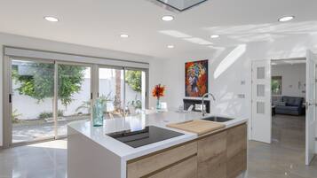 Microwave, dishwasher, coffee/tea maker, cookware/dishes/utensils