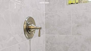 Shower, hair dryer, towels, shampoo