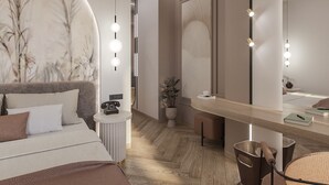 A modern bedroom with a large bed, a bedside table with a clock, a mirror, and a small seating area with a chair and a side table. - 1910 Legacy Hotel (Volos)