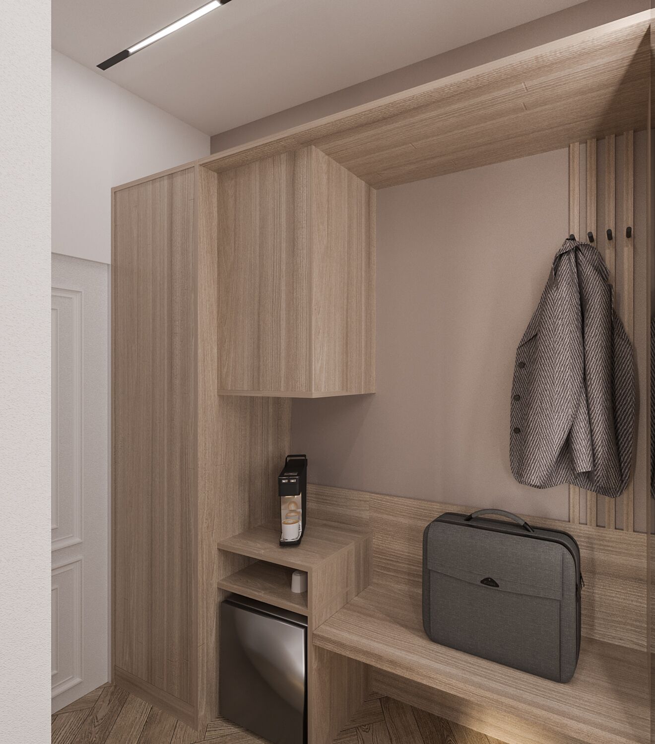Une salle de bain moderne et compacte, dotée d’une douche intégrée, d’une petite étagère avec une machine à café et d’une valise posée sur un meuble-lavabo en bois.