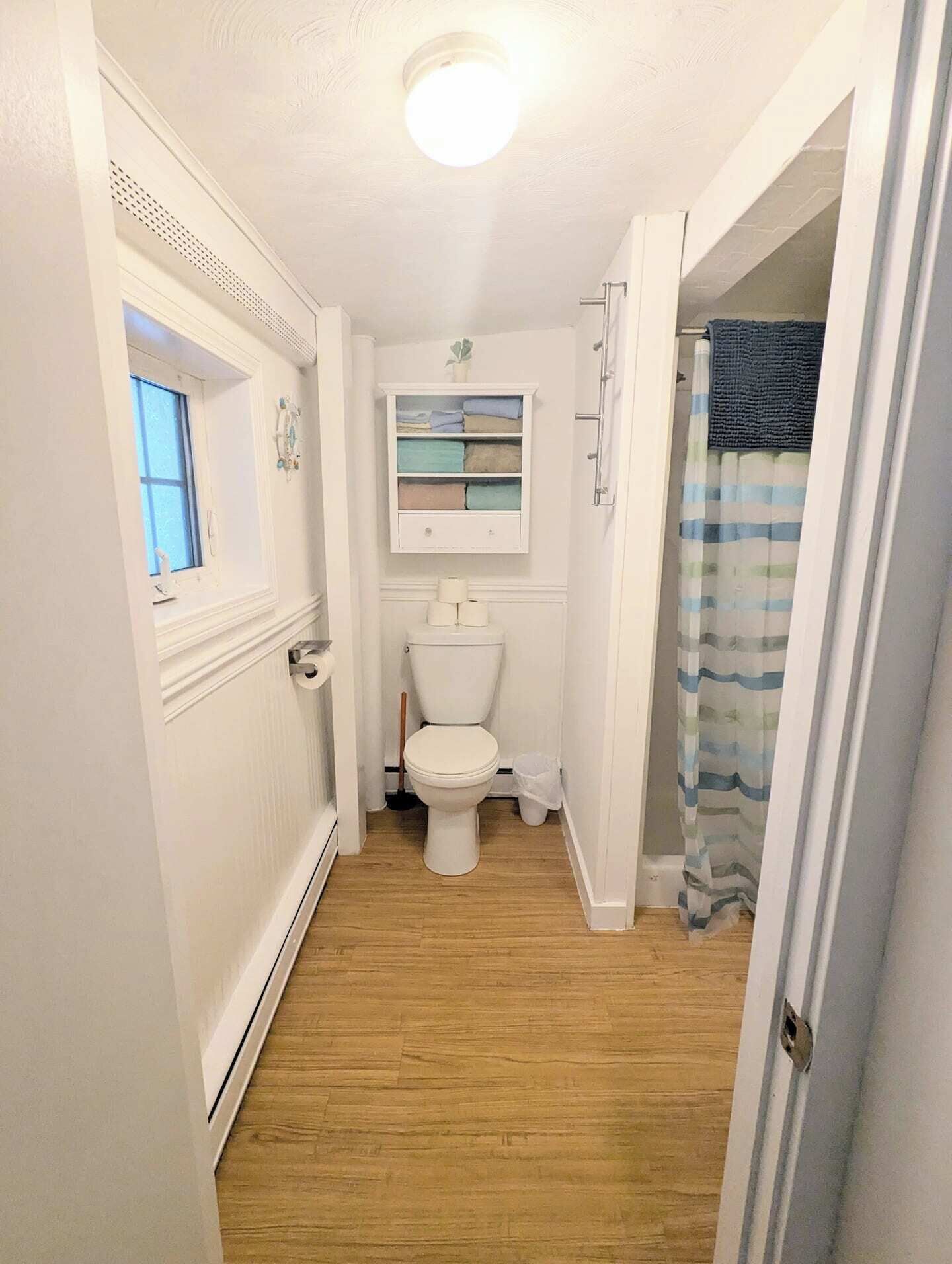 Shower, hair dryer, towels, toilet paper