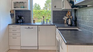 A modern kitchen with a dishwasher, a sink, and a coffee maker. - Gorgeous home in Odder with WiFi (Odder)