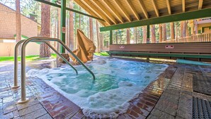 A hot tub area with a wooden deck, metal ladder, and a no smoking sign. - Walk to Shops & Eats: Mammoth Lakes Condo w/ Pool (Mammoth Lakes)