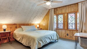A bedroom with a bed, wooden walls, a ceiling fan, and a window with curtains. - 2 Mi to Ossipee Lake: Forest-view Sanctuary! (Freedom)