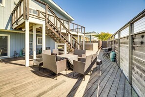 A wooden deck with outdoor furniture, a staircase, and a covered seating area. - Walk to Poplar Beach: Cozy Coastal Getaway w/ Yard (Half Moon Bay)