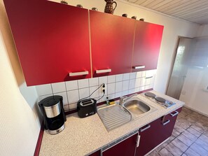 Fridge, stovetop, coffee/tea maker, electric kettle